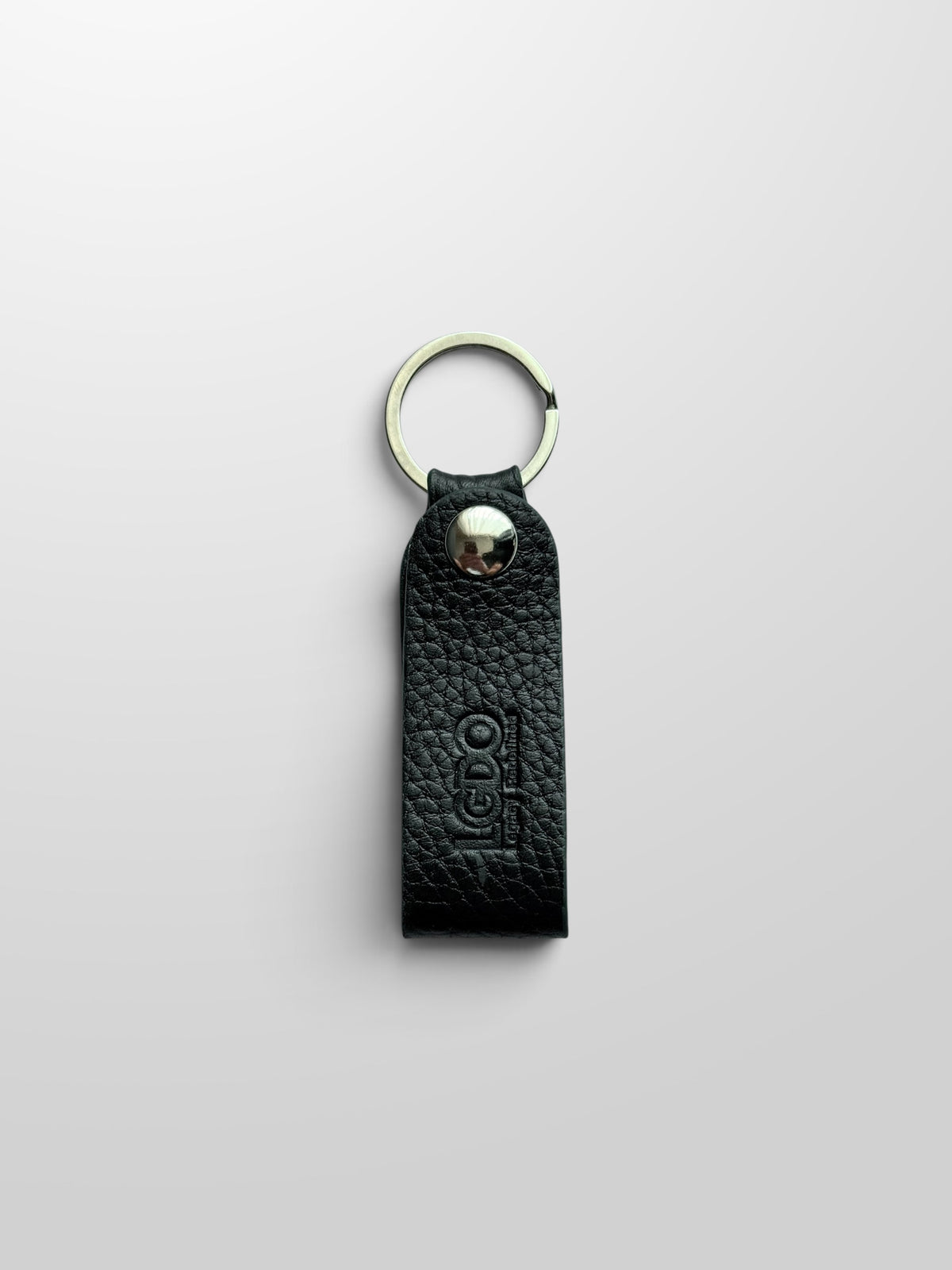 Black leather key holder with Legacy Green painted edges, front view