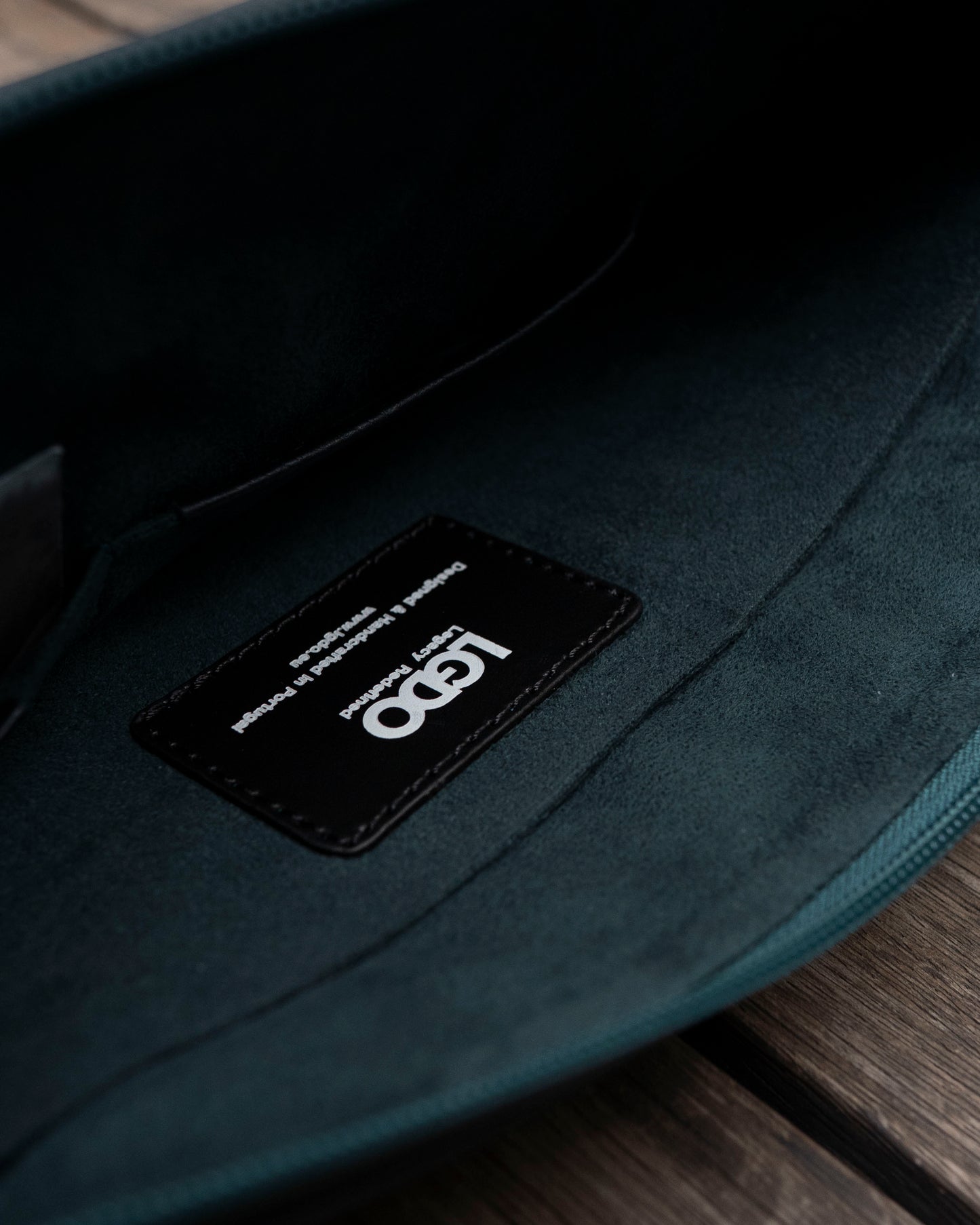 LGDO inside green microfiber lining of leather sleeve showing brand label