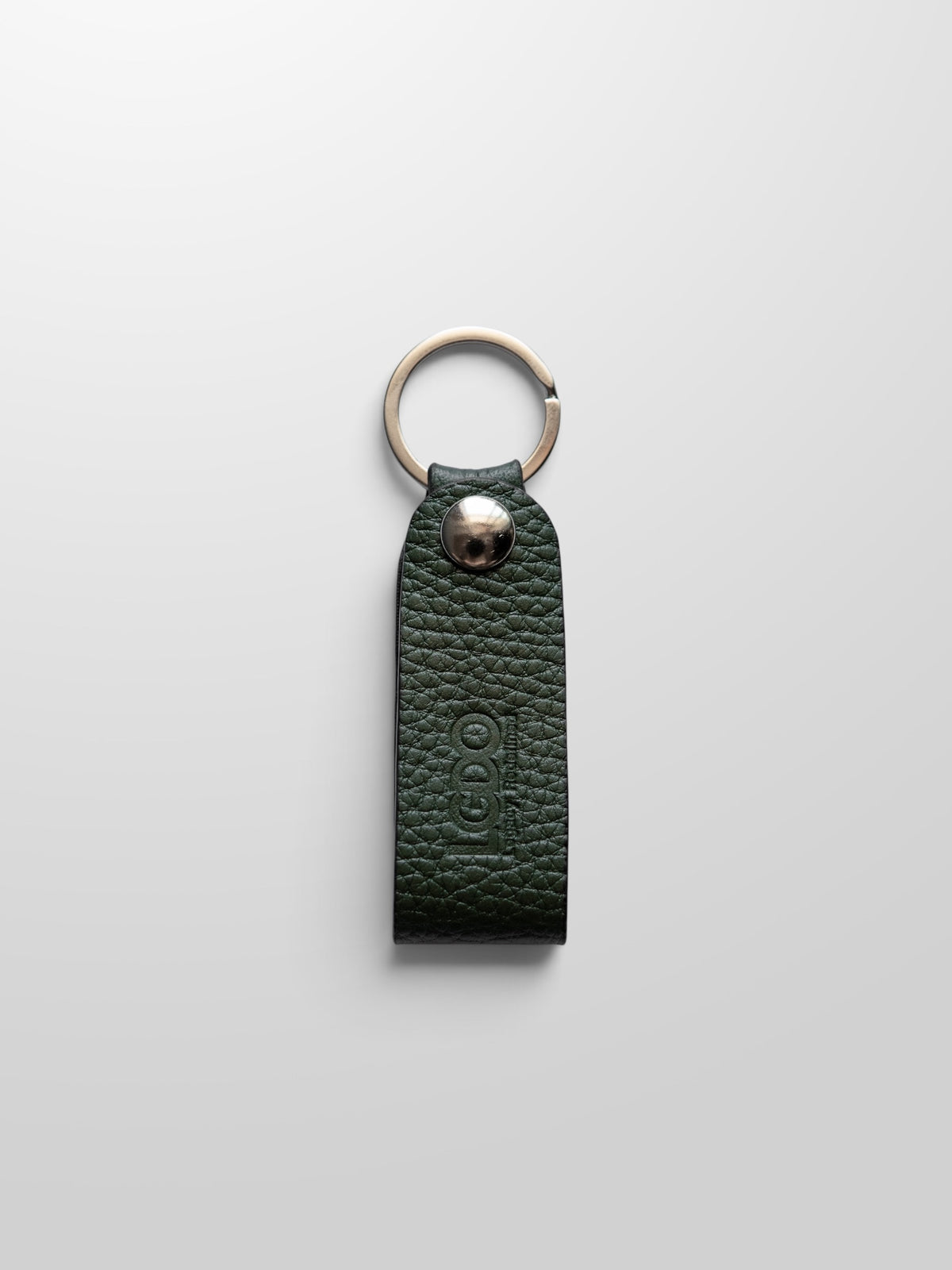 Legacy Green leather key holder with black painted edges, front view